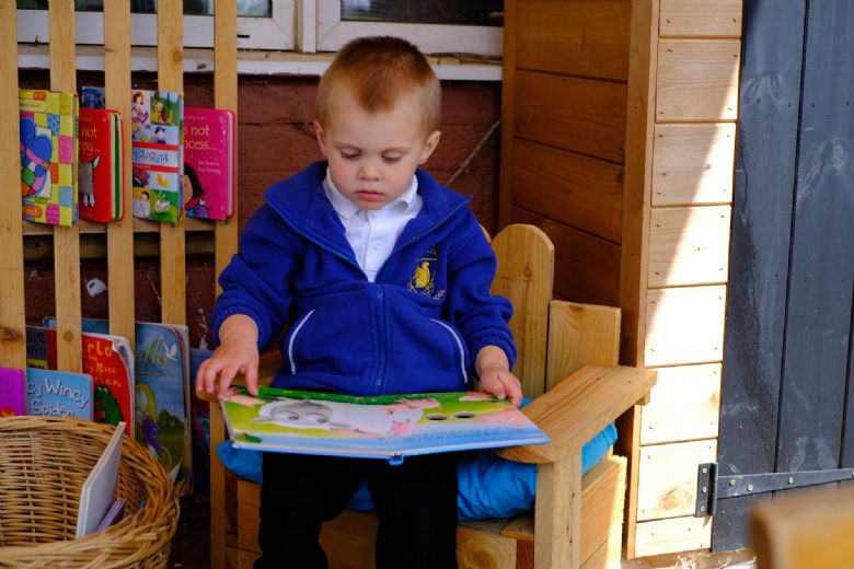 Child reading a book